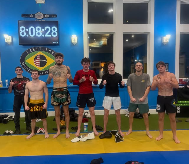 Solomon, second from left in yellow-trimmed shorts, with training partners at Limitless BJJ